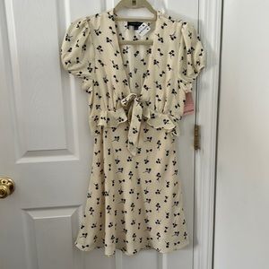 White dress with black flower detailing